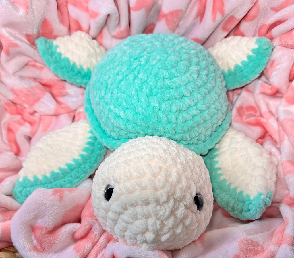 Large handmade crochet sea turtle plushie in mint and white chenille with expressive safety eyes