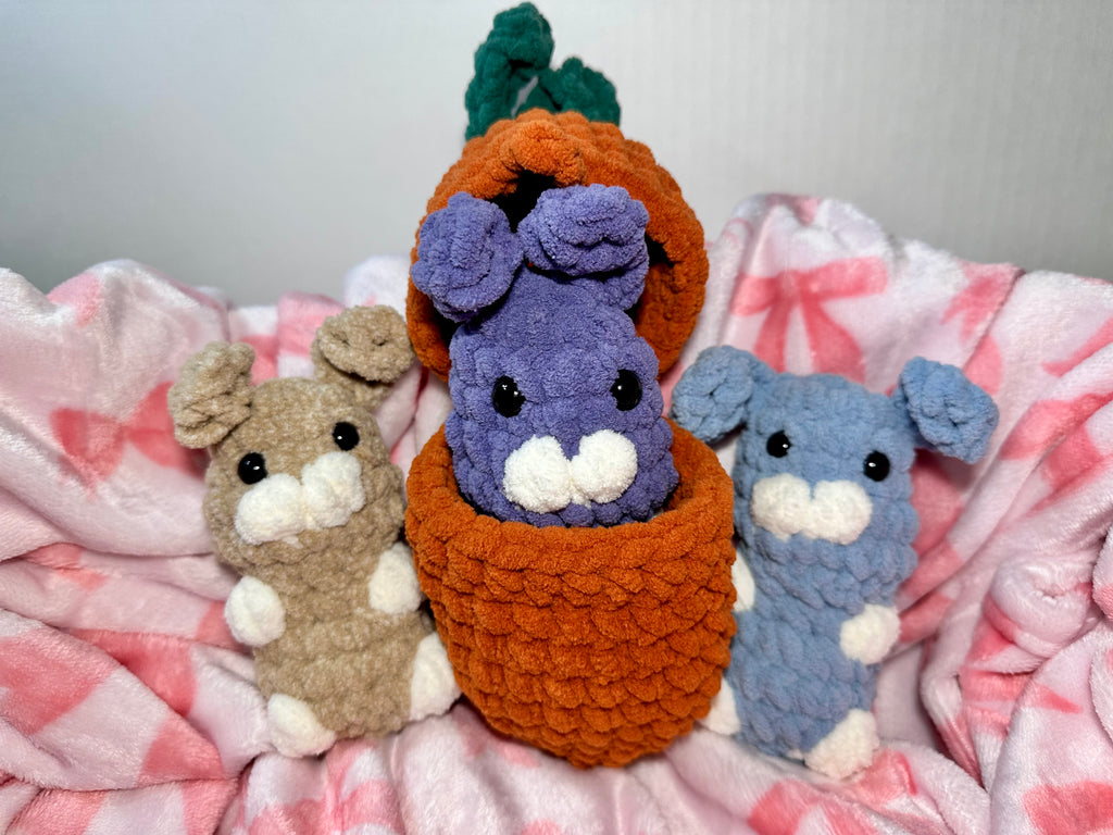 The Hutch Bunnies with carrot basket — Clover, Violet, and Slate