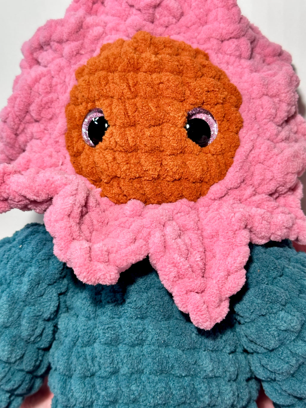 Rosie the Sunflower — close-up showing pink petal collar and shimmering safety eyes