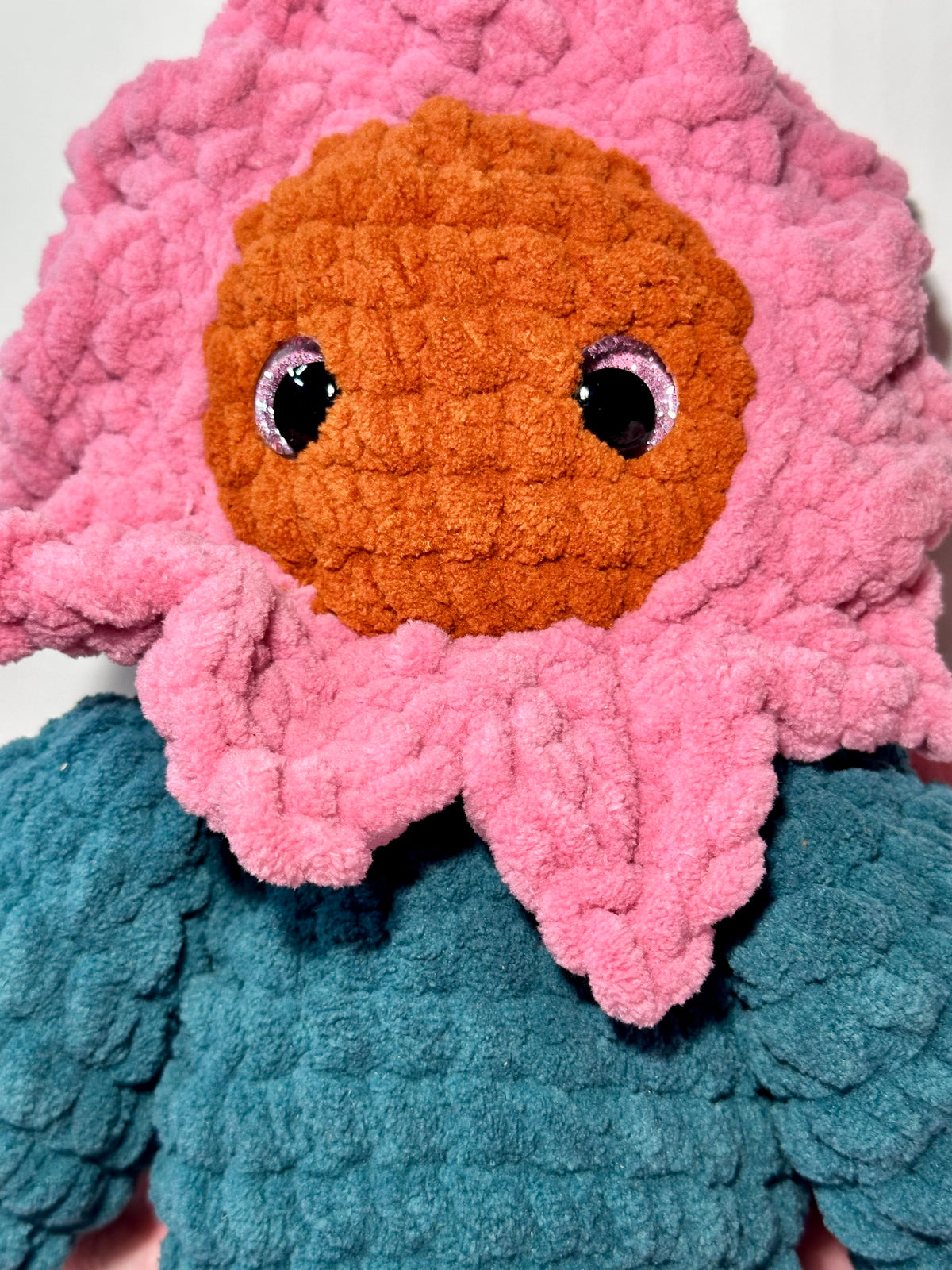 Rosie the Sunflower — close-up showing pink petal collar and shimmering safety eyes