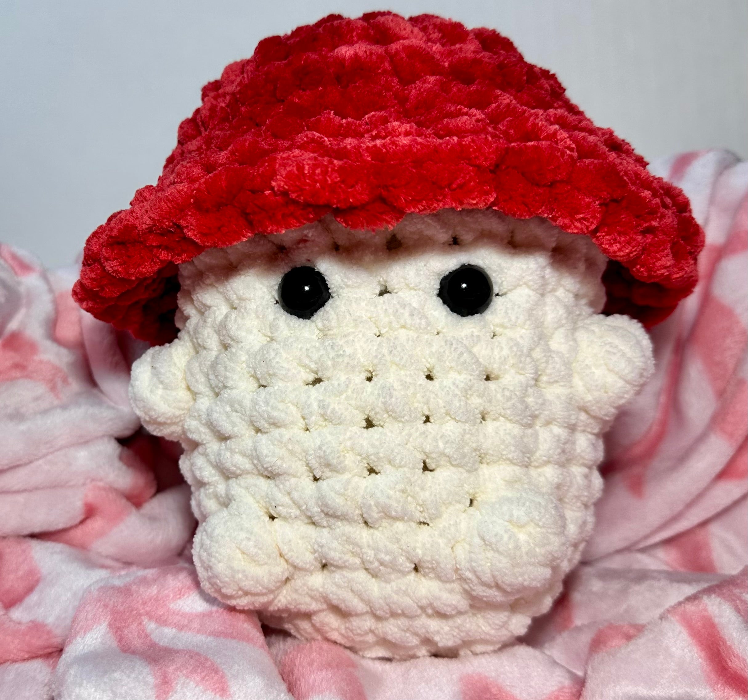 Crimson the Mushroom — front view showing black safety eyes and red cap detail